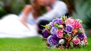 Elegant Bridal Bouquet In Bride's Hands Wallpaper