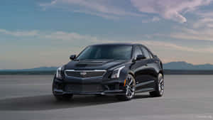 Elegant Cadillac Ats Cruising On The Road Wallpaper