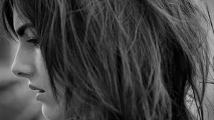 Elegant Camilla Belle Striking A Pose In A Stunning Outfit Wallpaper