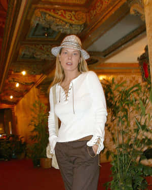 Elegant Casual Attirein Opulent Setting Wallpaper