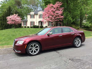 Elegant Chrysler 300 Gliding On Asphalt Wallpaper