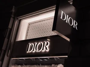 Elegant Dior Storefrontat Night Wallpaper