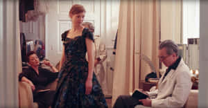 Elegant Dress Fitting Session Wallpaper