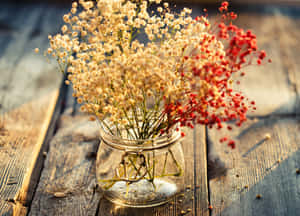 Elegant Dried Flowers Arrangement Against A Vintage Background. Wallpaper