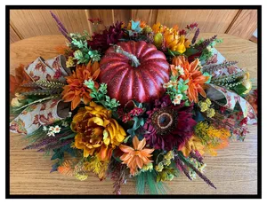 Elegant Fall Wreath Adorning A Wooden Door Wallpaper