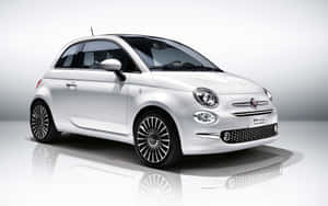 Elegant Fiat Cinquecento In Natural Urban Setting Wallpaper