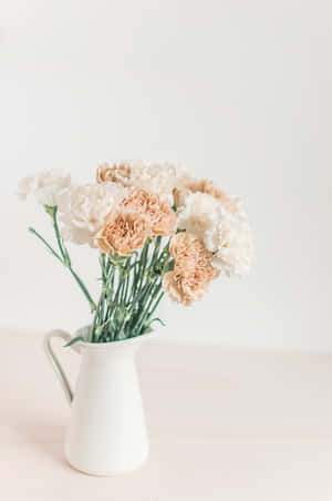 Elegant Floral Arrangementin White Vase Wallpaper