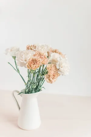 Elegant Floral Arrangementin White Vase Wallpaper