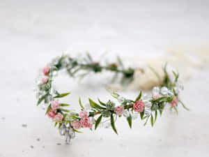 Elegant Floral Crown On A Bright Table Wallpaper