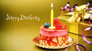 Elegant Golden Birthday Cake Candles Wallpaper