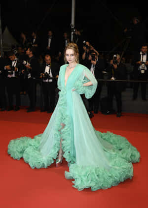 Elegant Green Gown Red Carpet Event Wallpaper