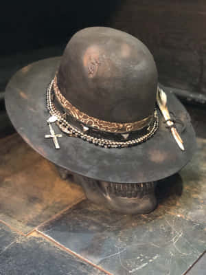 Elegant Hat On A Mannequin In A Stylish Setting Wallpaper