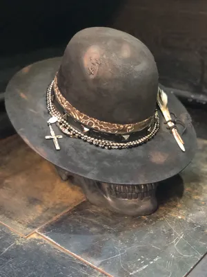 Elegant Hat On A Mannequin In A Stylish Setting Wallpaper