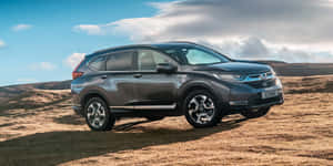 Elegant Honda Cr-v On A Scenic Road Wallpaper