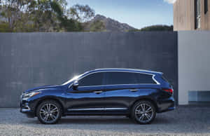 Elegant Infiniti Qx60 Driving On A Picturesque Road Wallpaper