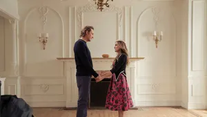 Elegant Interior Scenewith Couple Wallpaper