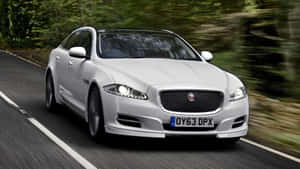 Elegant Jaguar Xj In Motion Wallpaper