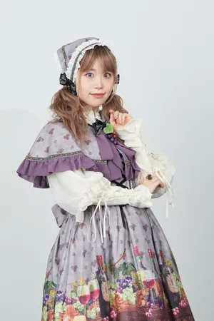 Elegant Lolita Fashion Enthusiast Posing In An Exquisite Vintage Dress Wallpaper