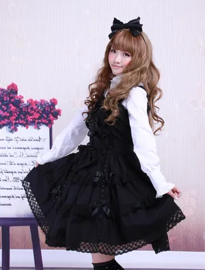 Elegant Lolita Fashionista Posing In A Beautiful Dress Wallpaper