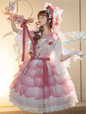 Elegant Lolita Fashionista Posing In Her Chic Attire Wallpaper