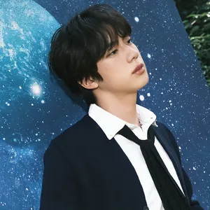 Elegant_ Man_ Against_ Starry_ Background Wallpaper