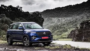 Elegant Mg Classic Car On The Road Wallpaper