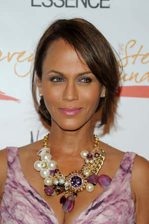 Elegant Nicole Ari Parker Posing In A Ravishing Dress Wallpaper