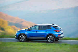 Elegant Opel Grandland X In Nature Wallpaper