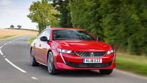 Elegant Peugeot 508 Gliding On The Road Wallpaper