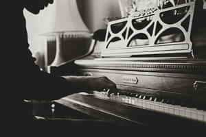 Elegant_ Piano_ Playing_ Monochrome.jpg Wallpaper