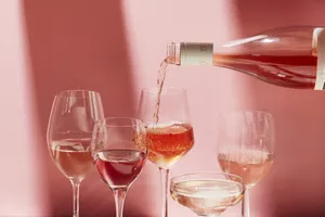 Elegant Pink Champagne In Flutes Wallpaper