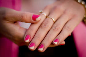 Elegant Pink Nails On A Beautiful Hand Wallpaper