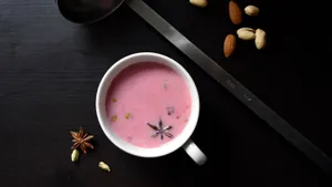 Elegant Pink Tea In A Delicate Glass Cup Wallpaper