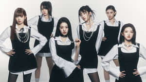 Elegant Pop Groupin Blackand White Outfits Wallpaper