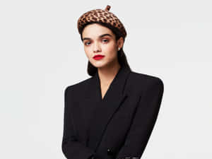 Elegant Portrait Rachel Zegler Leopard Beret Wallpaper