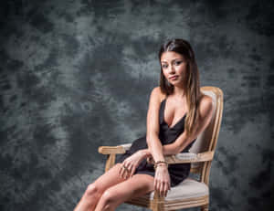 Elegant Portrait Woman Classic Chair Wallpaper