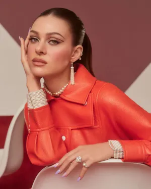 Elegant Portraitin Orange Leather Jacket Wallpaper