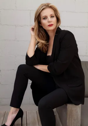 Elegant Portraitof Womanin Black Outfit Wallpaper