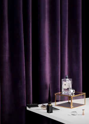 Elegant Purple Curtainswith Perfume Bottle Wallpaper