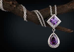 Elegant Purple Gemstone Pendant Jewelry Wallpaper