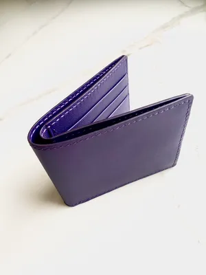 Elegant Purple Leather Wallet Wallpaper