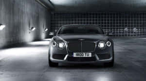 Elegant Red Convertible Riding Into The Sunset Wallpaper