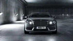 Elegant Red Convertible Riding Into The Sunset Wallpaper