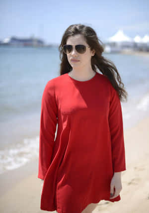 Elegant Red Dress Beach Walk Wallpaper