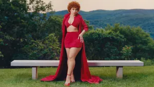 Elegant Red Ensemble Outdoors Wallpaper