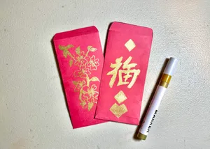 Elegant Red Envelope On A Wooden Surface Wallpaper