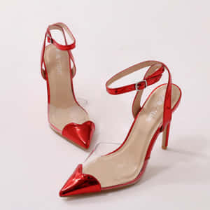 Elegant Red High Heels On A Sleek Background Wallpaper