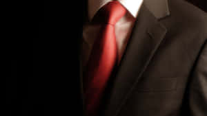 Elegant Red Tie On A Crisp White Shirt Wallpaper