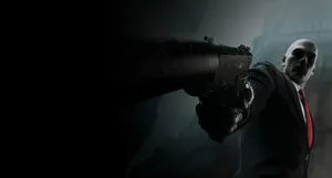 Elegant Red Tie With A Sleek Knot On A Striped Suit Wallpaper