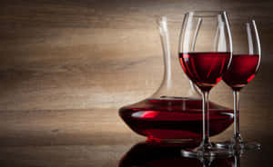 Elegant Red Wine Glass In A Romantic Setting Wallpaper